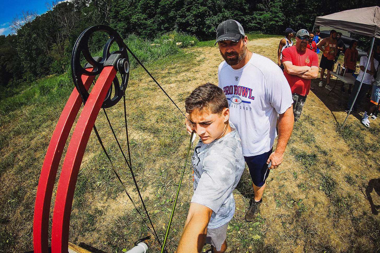 instructing a young archer