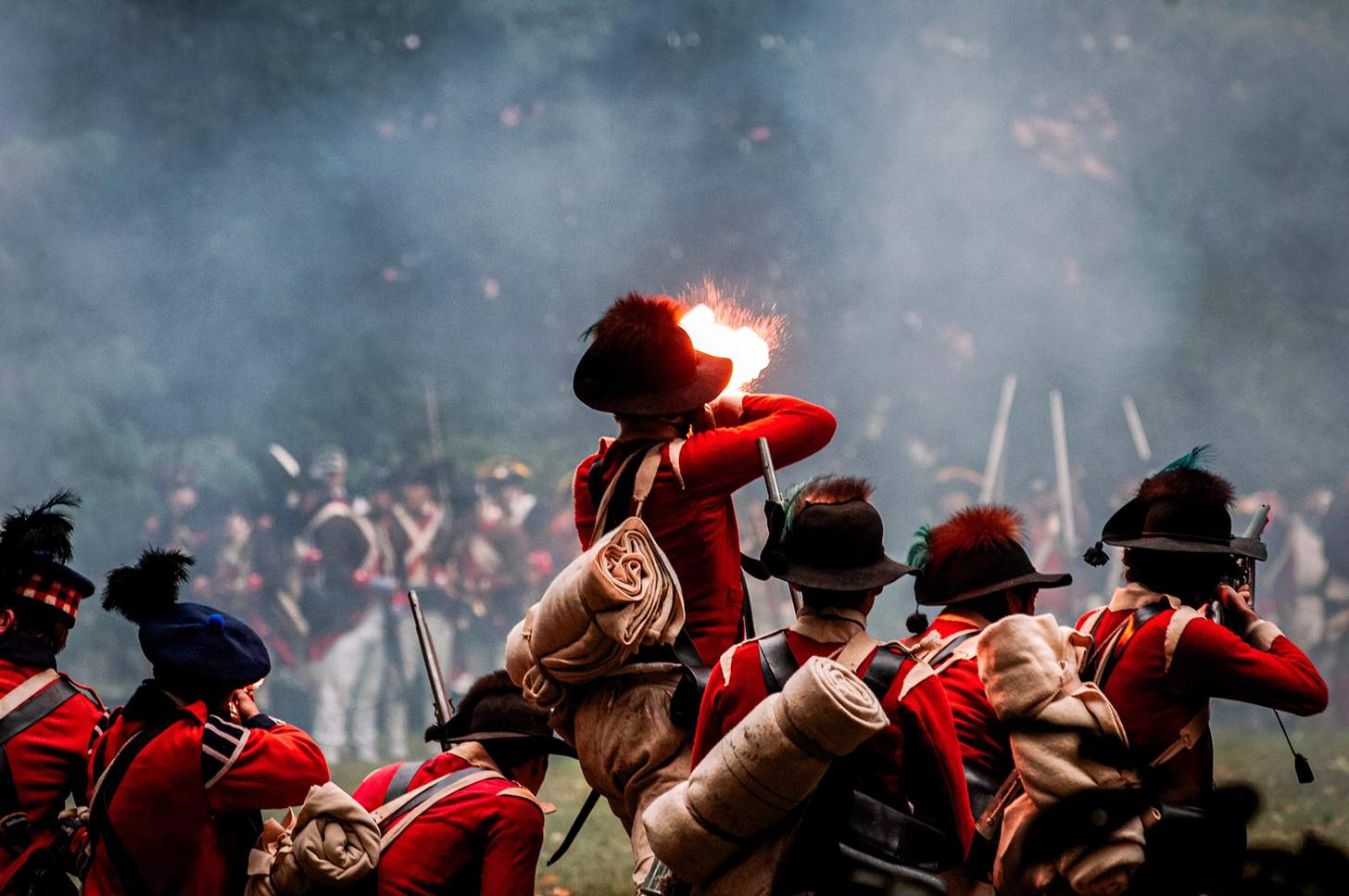 revolutionary war reenactors firing muskets