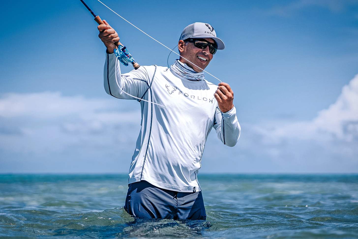 a man saltwater fly fishing in FORLOH apparel