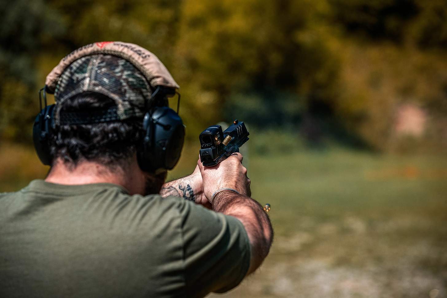 A man firing the Walther PDP F Pro ACRO