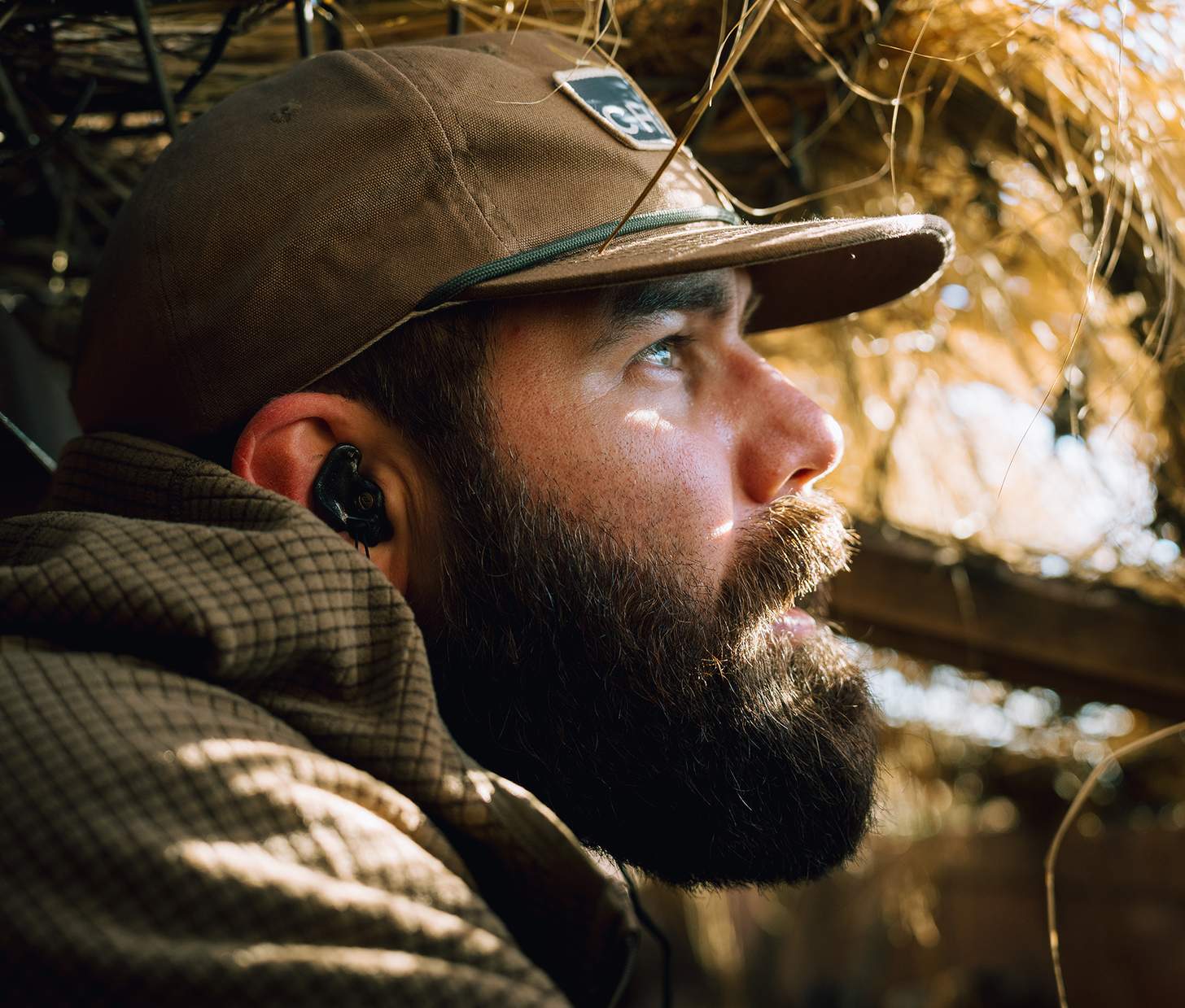 Jordan Davis peers out of a duck blind