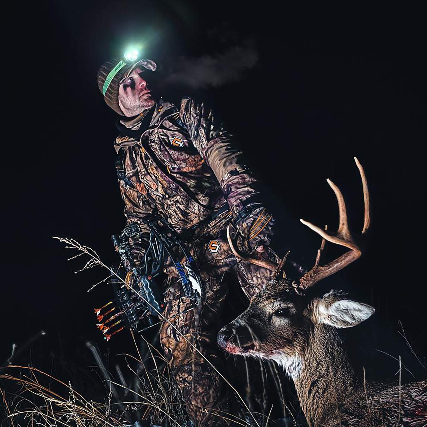 YouTuber Matt Jennins dragging a whitetail buck