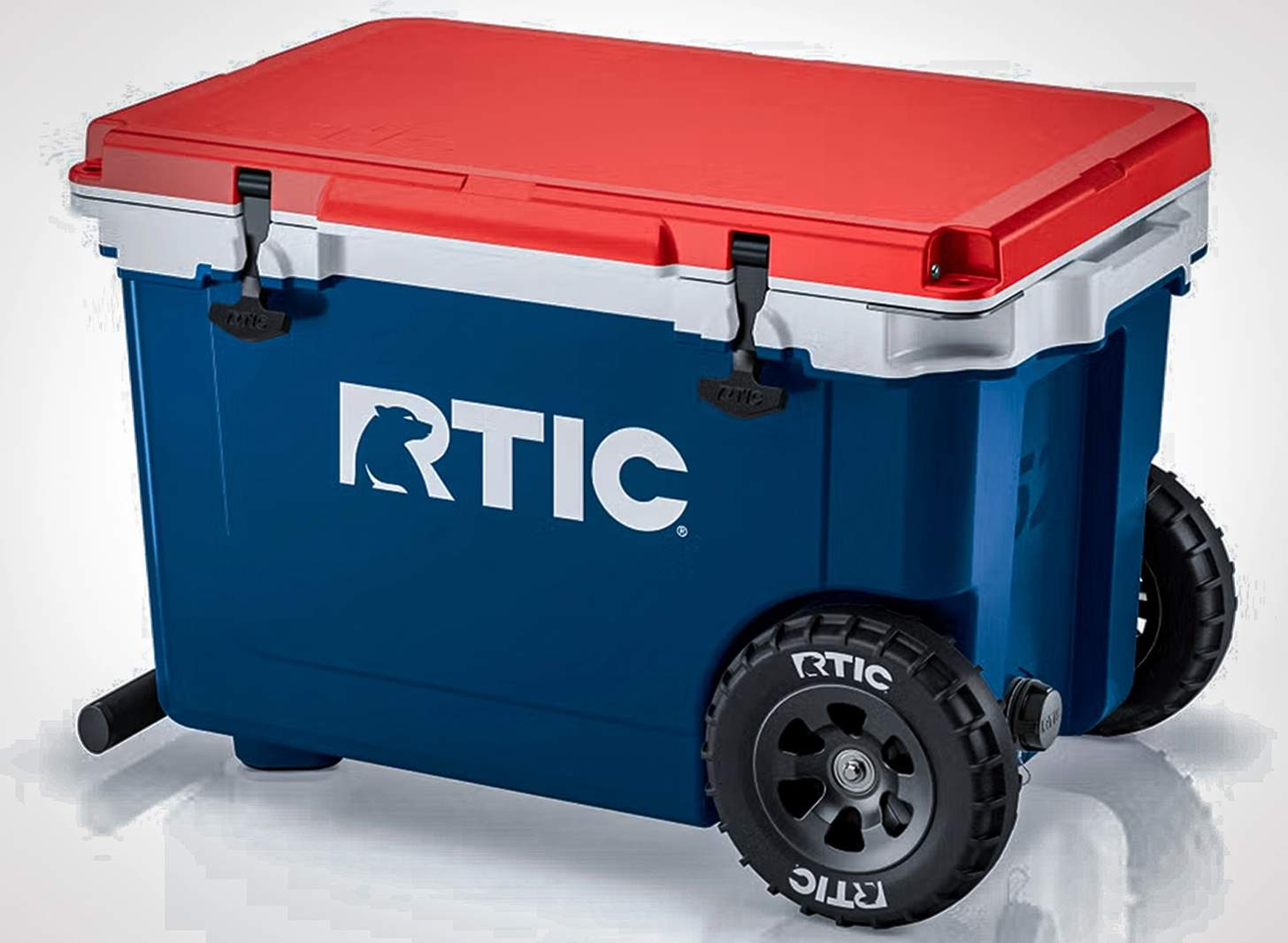 the RTIC 52 quart ultra-light wheeled cooler in red white and blue
