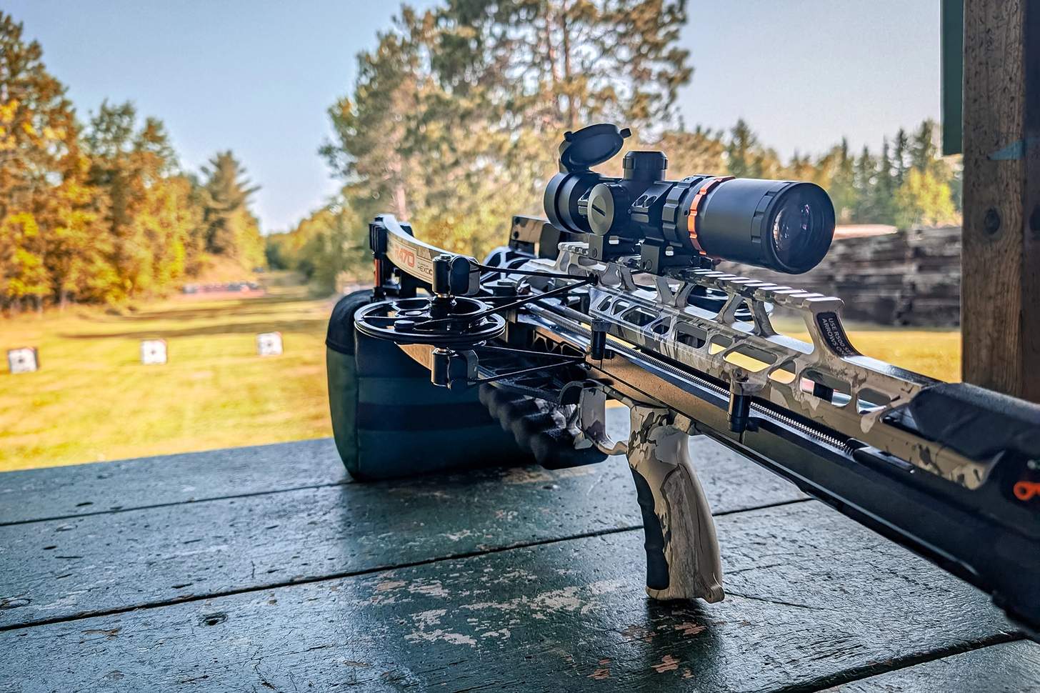 a Ravin R470 crossbow resting on a bipod on a shooting bench