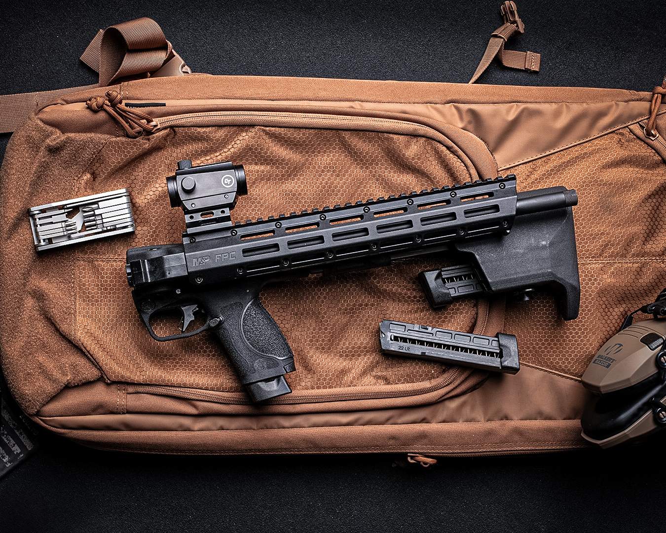 Smith & Wesson M&P FPC 22LR on a backpack folded