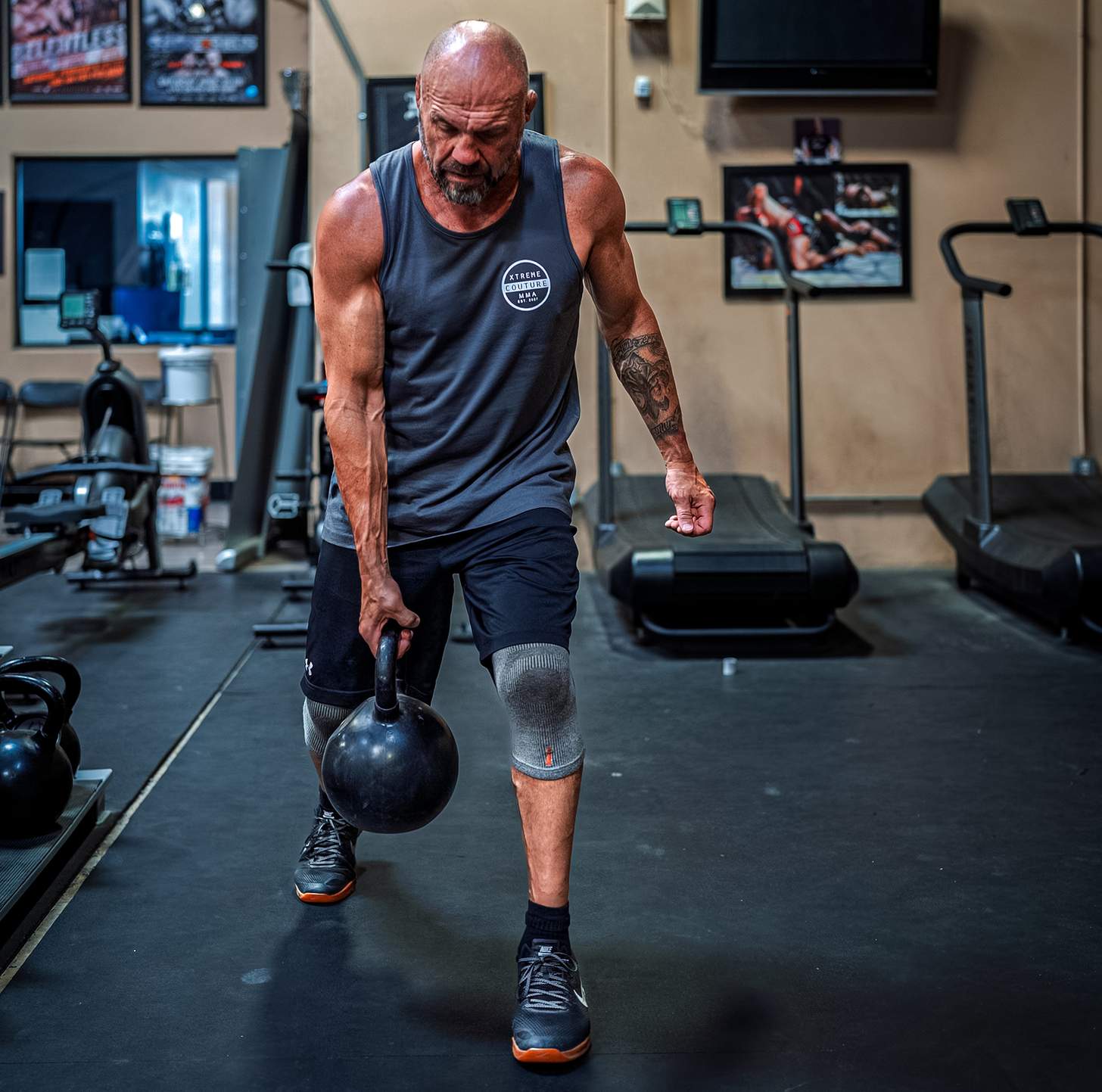 Randy Couture working with a kettlebell in the gym