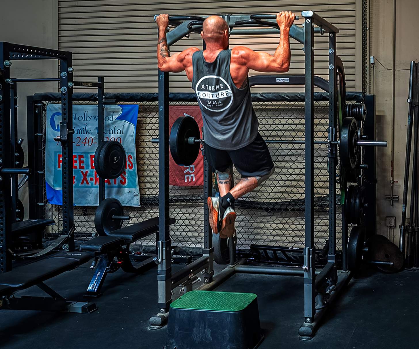 Randy Couture doing pull ups in the gym