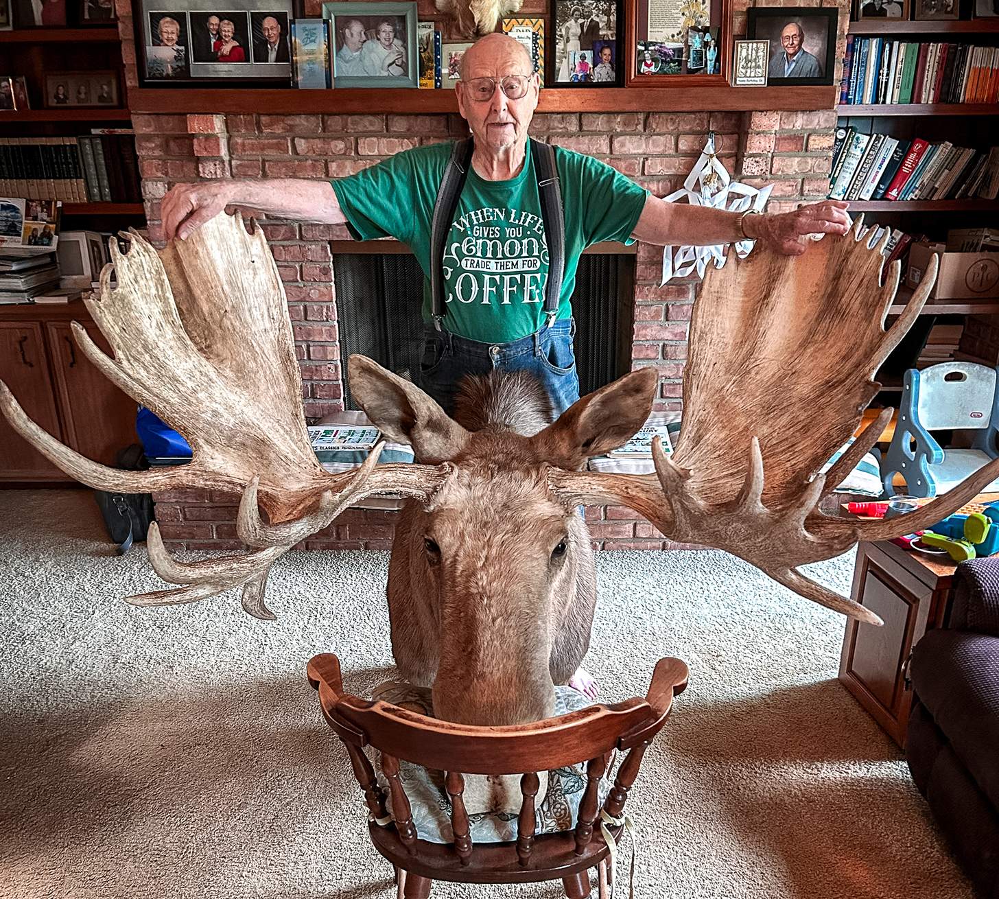 Ed Hall, 95, with the mount of Old Ugly, a B&C record moose he shot in 1970, in his home.