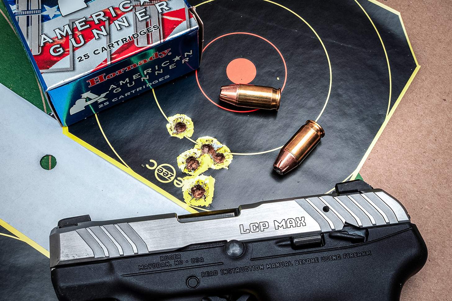 Ruger LCP Max pistol with target and loose Hornady 9mm ammo