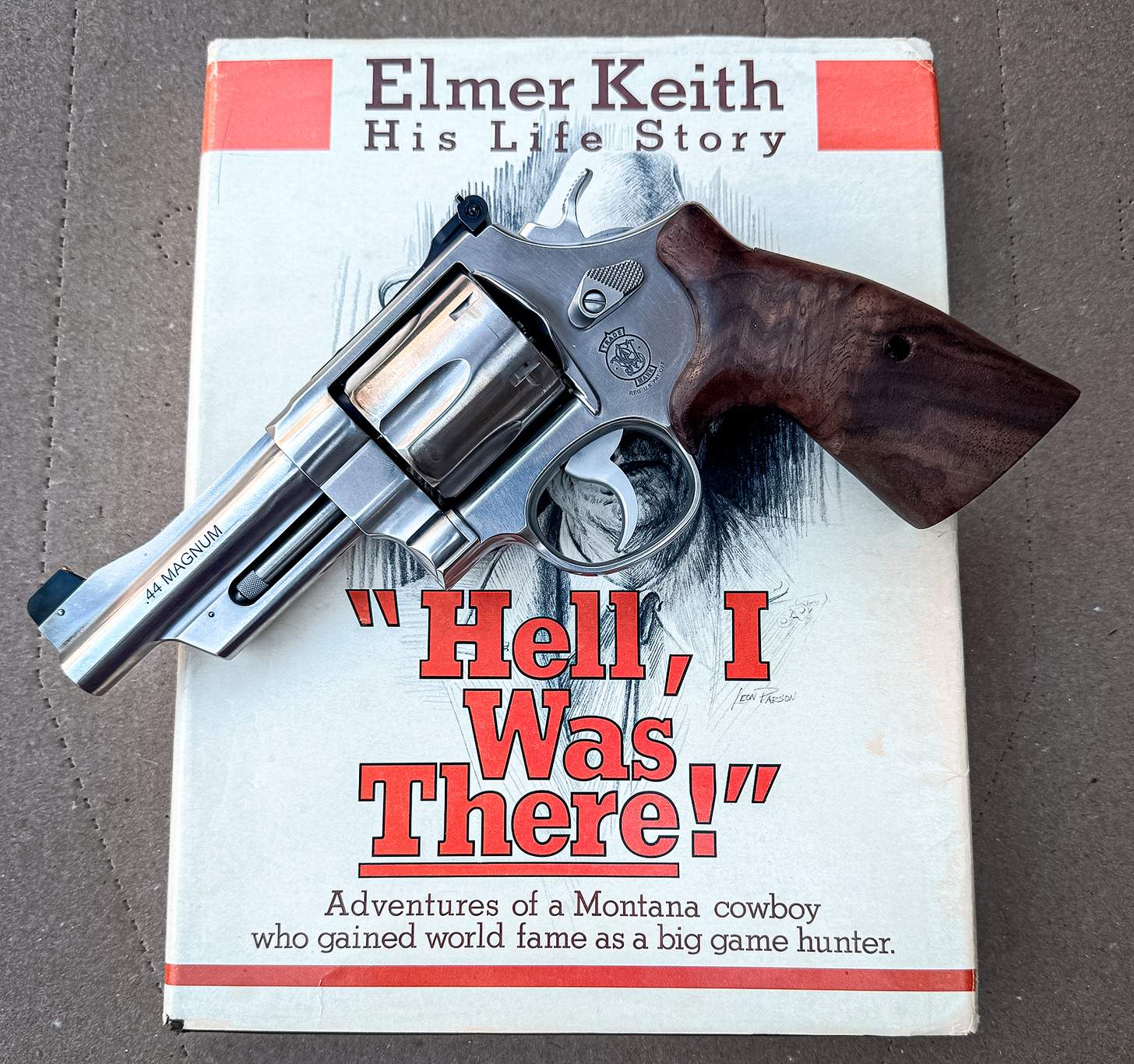 the S&W Model 629 Mountain Gun in .44 Magnum laying on Elmer Keith's book Hell I Was There
