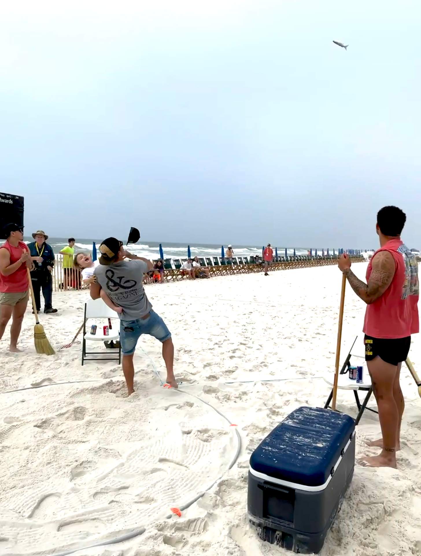 John Radzwilla tosses a mullet with his son