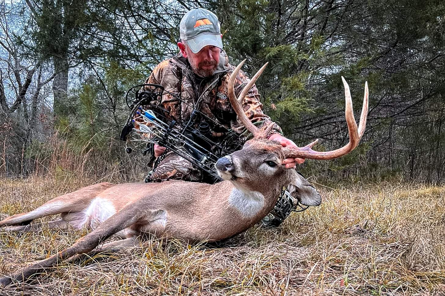 bowhunter with a nice whitetail buck Photo: Molly Maloch how to choose a compound bow