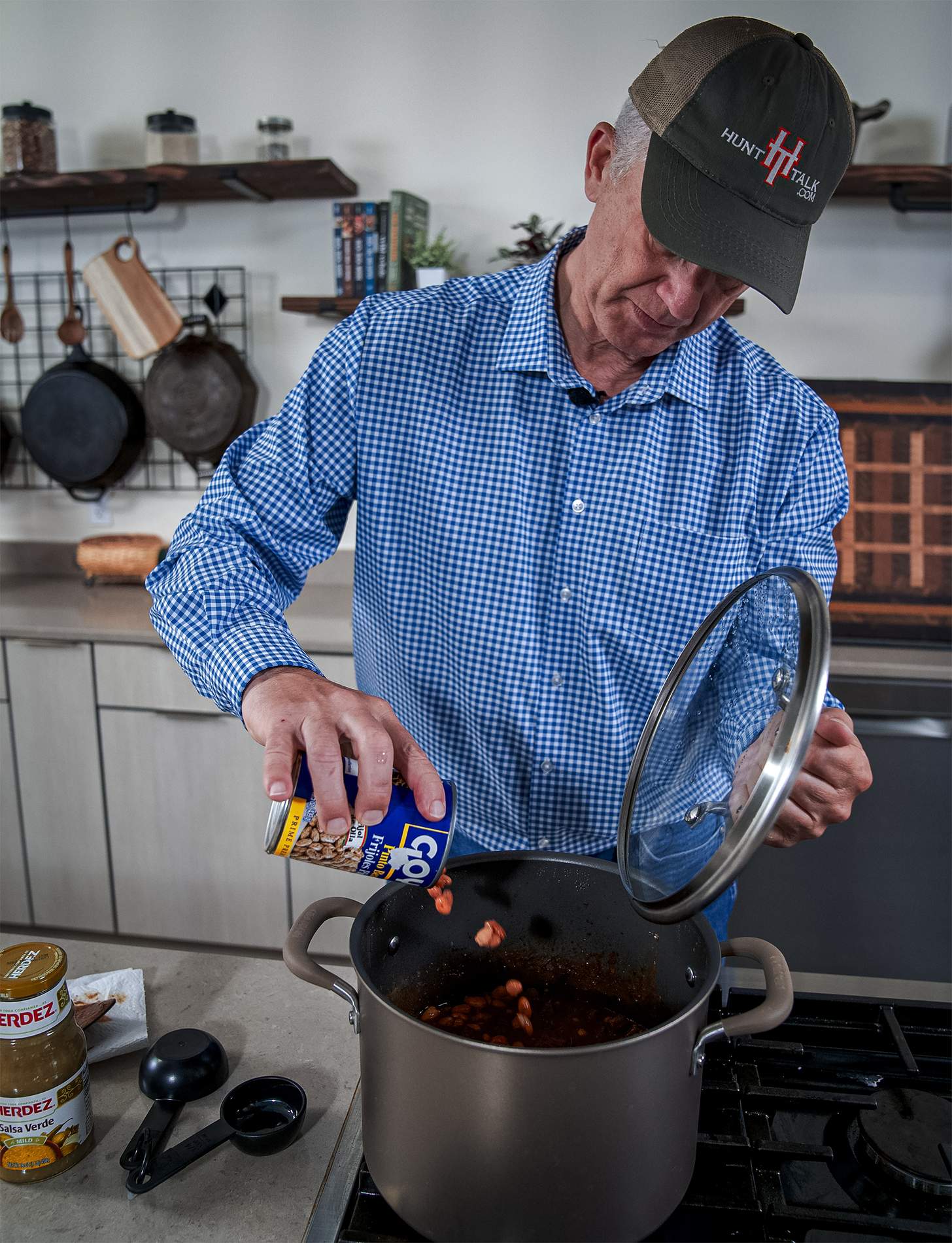 Randy Newberg adding ingredients to the pot