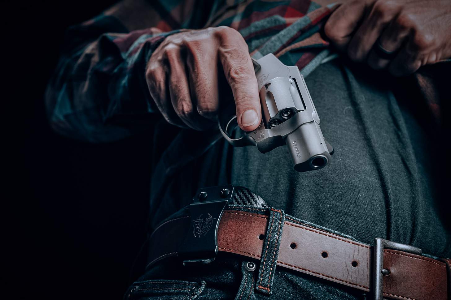 revolver being drawn from an IWB holster