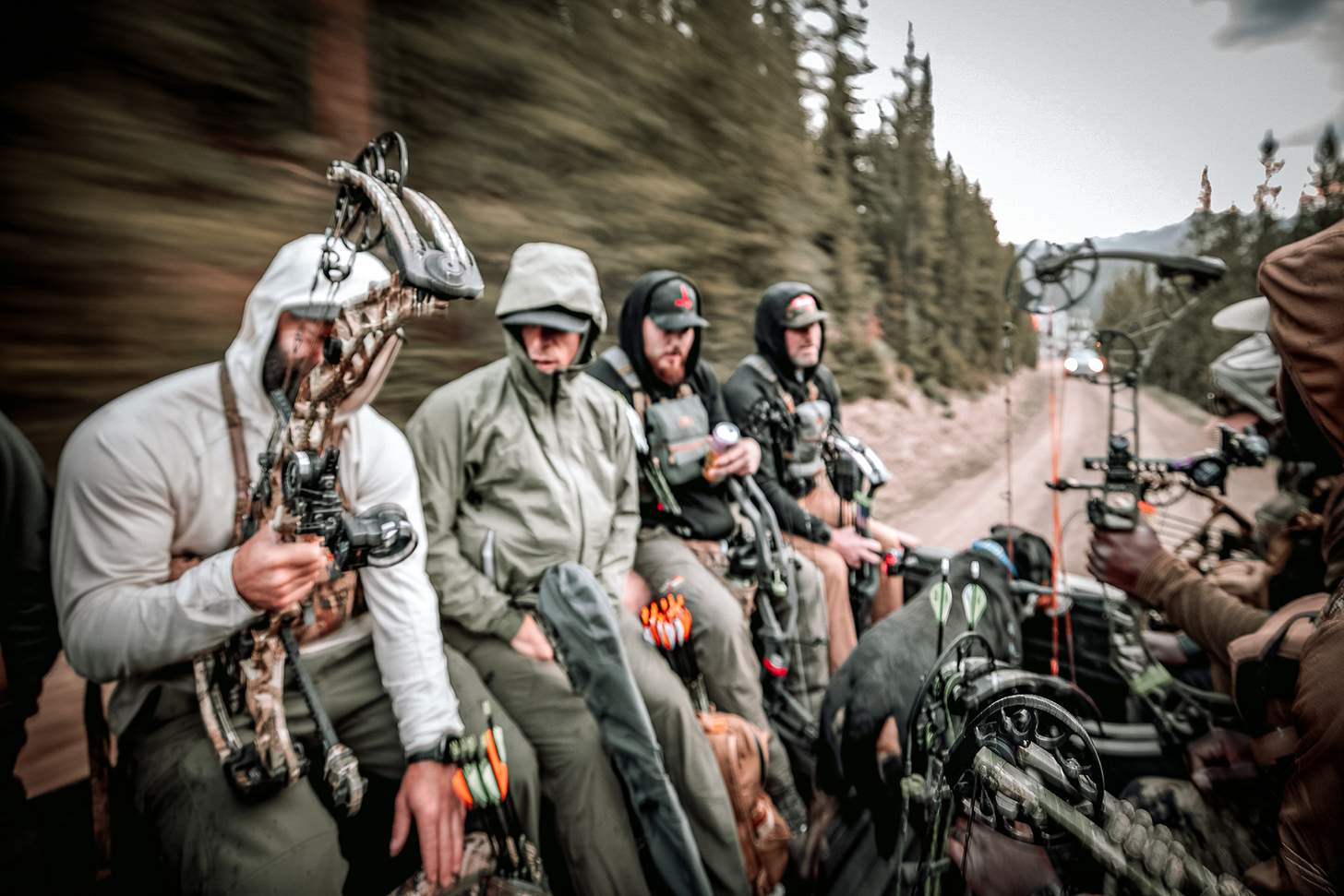 competitors riding in the back of a truck at the yellowstone TAC Big Sky event