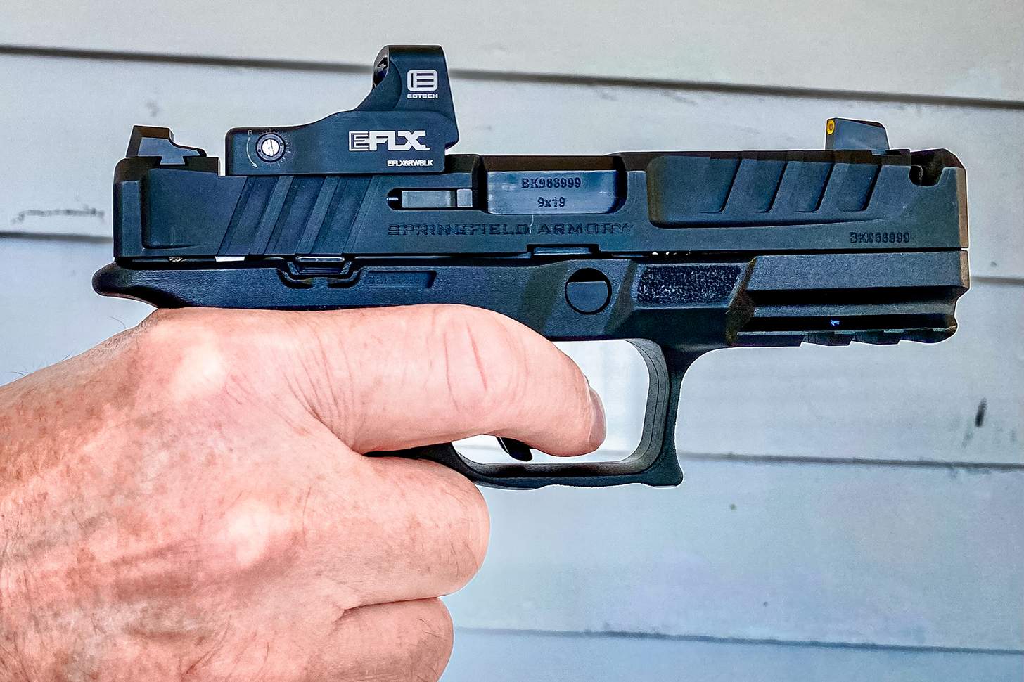 the author shooting the new Springfield Echelon 4.0C Comp 9mm handgun with an EOTech EFLX red dot