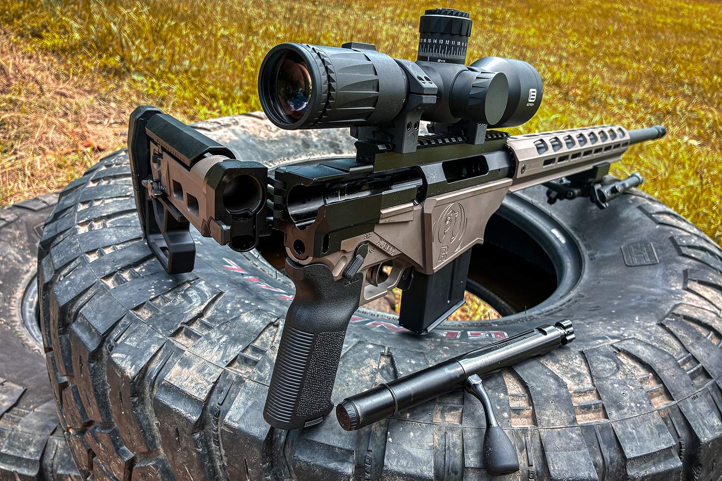 the rifle with stock folded and bolt removed