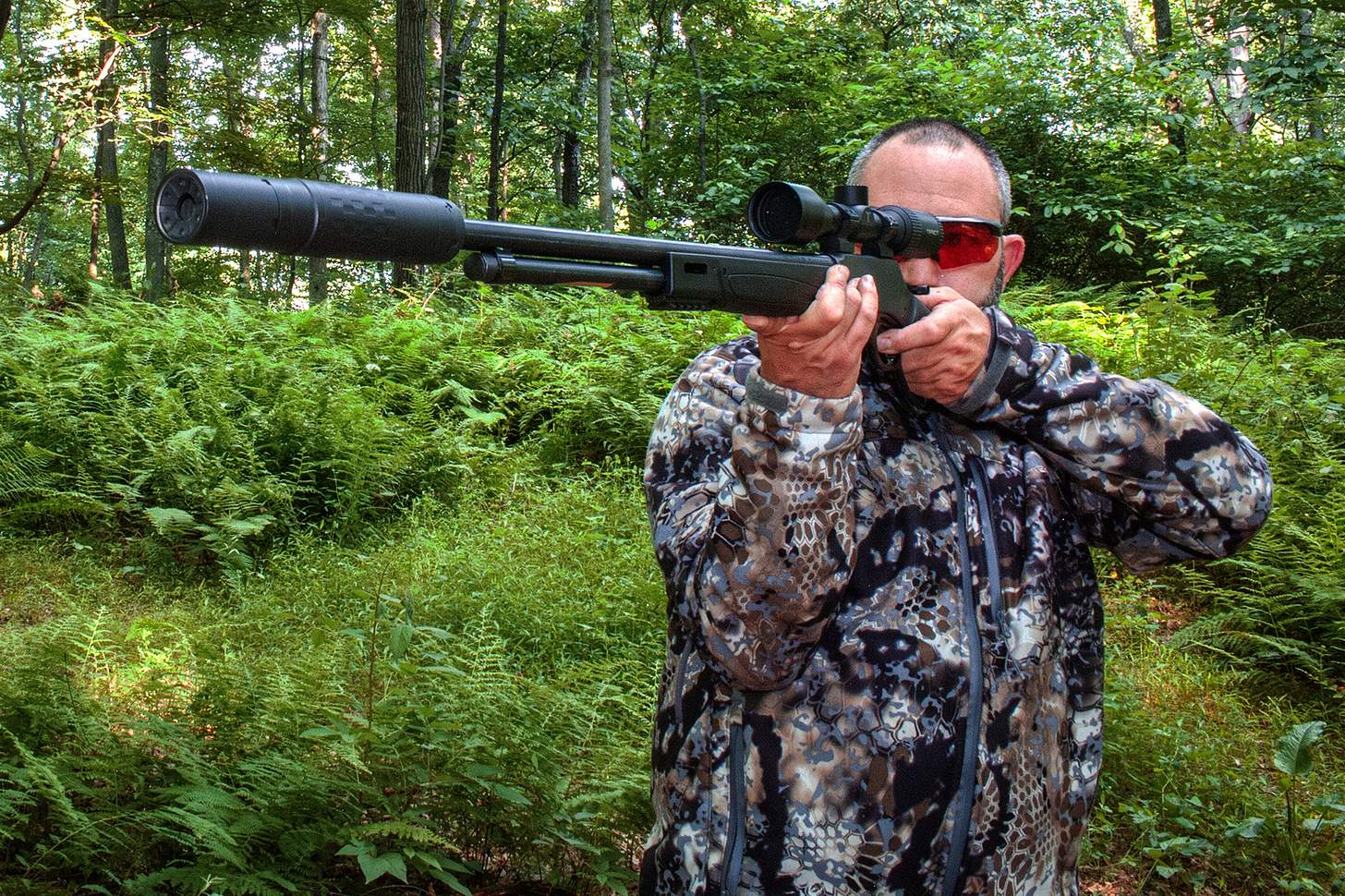 the author firing a Henry Model X Rifle with a SilencerCo suppressor and Remington Core-Lokt .360 Buckhammer