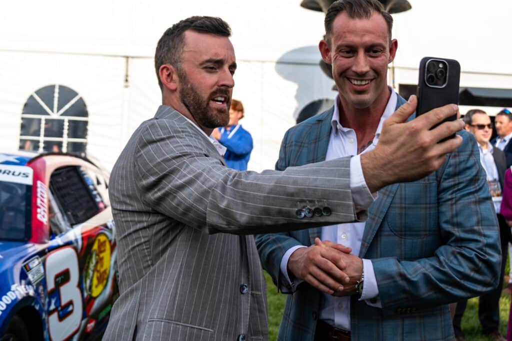 Austin Dillon and Johnny Joey Jones are doing the selfie thing at the Winchester No. 3 unveiling event in May 2025.