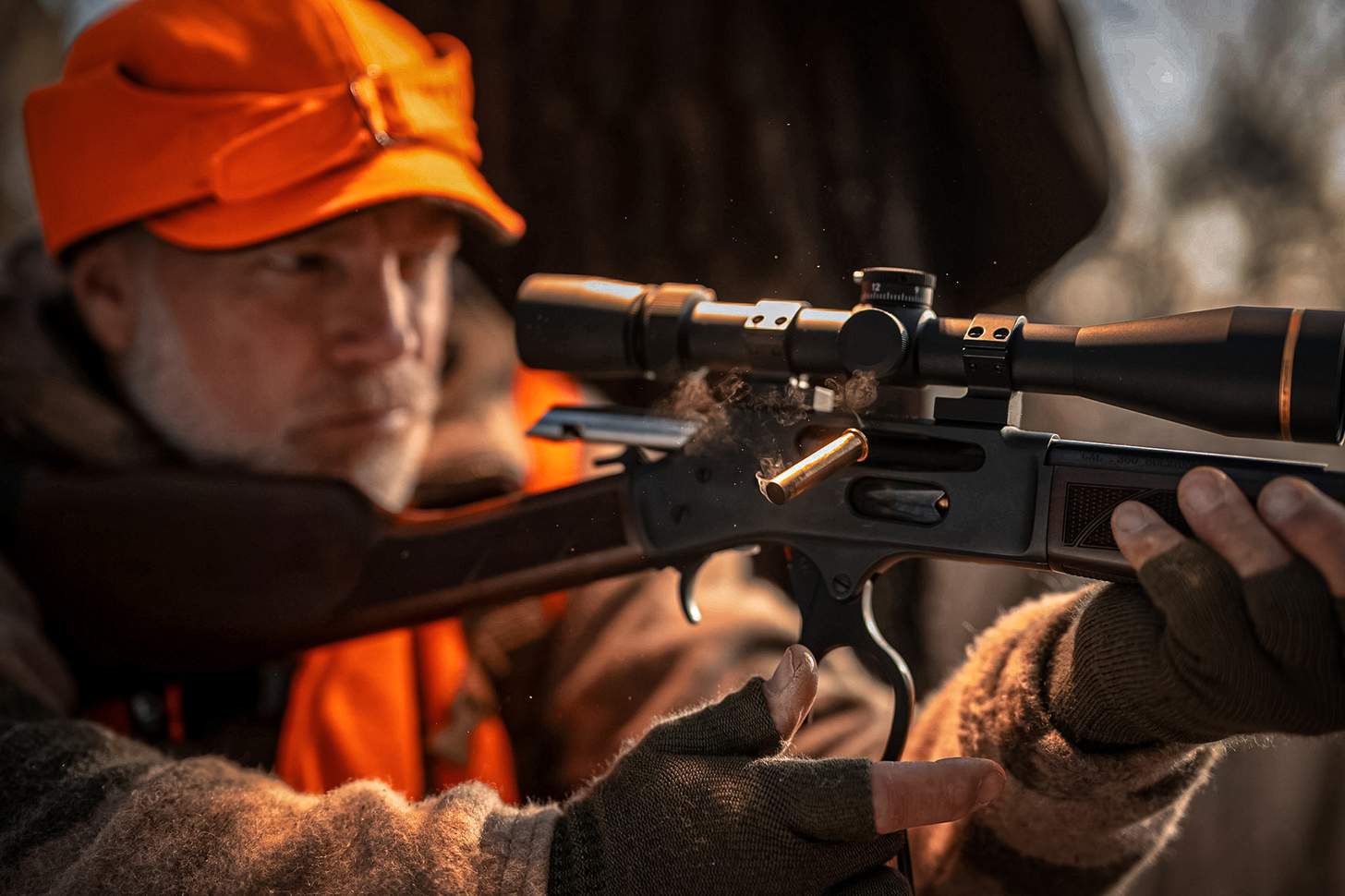 a lever action rifle ejecting ar ound