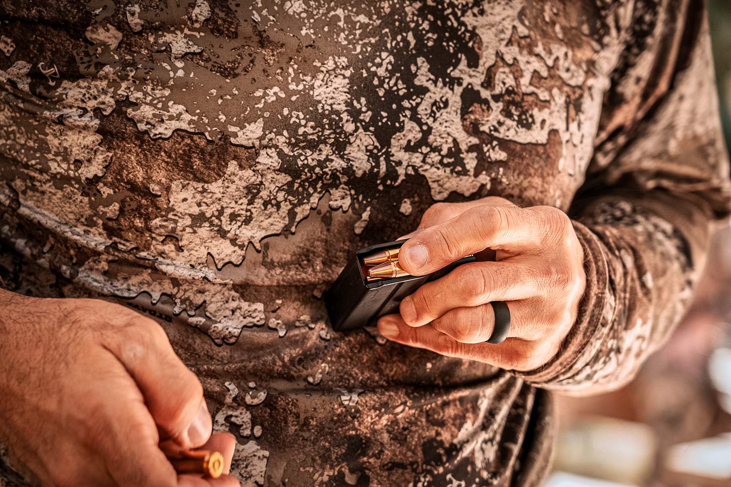 loading rounds into a magazine