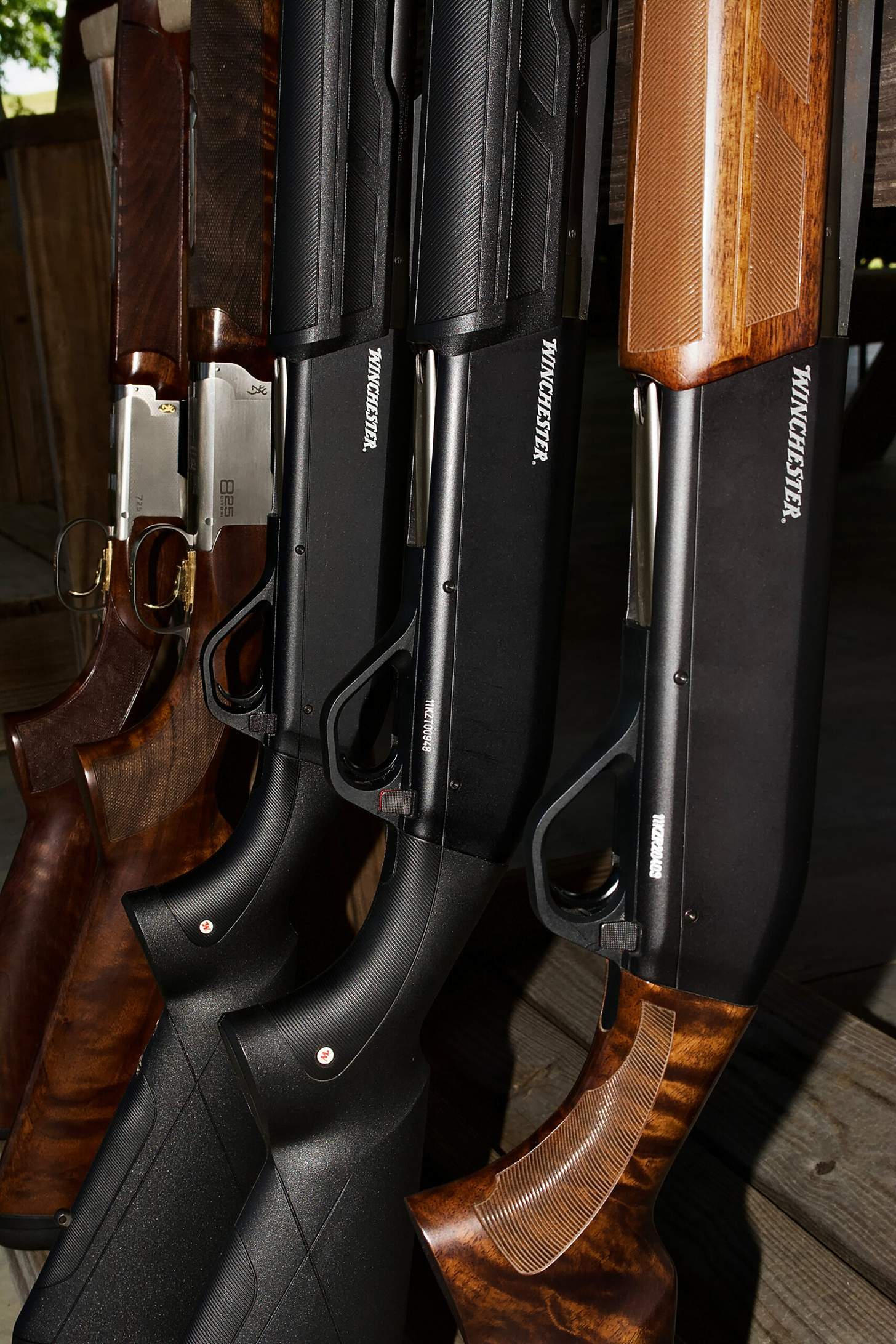 winchester shotguns on a rack