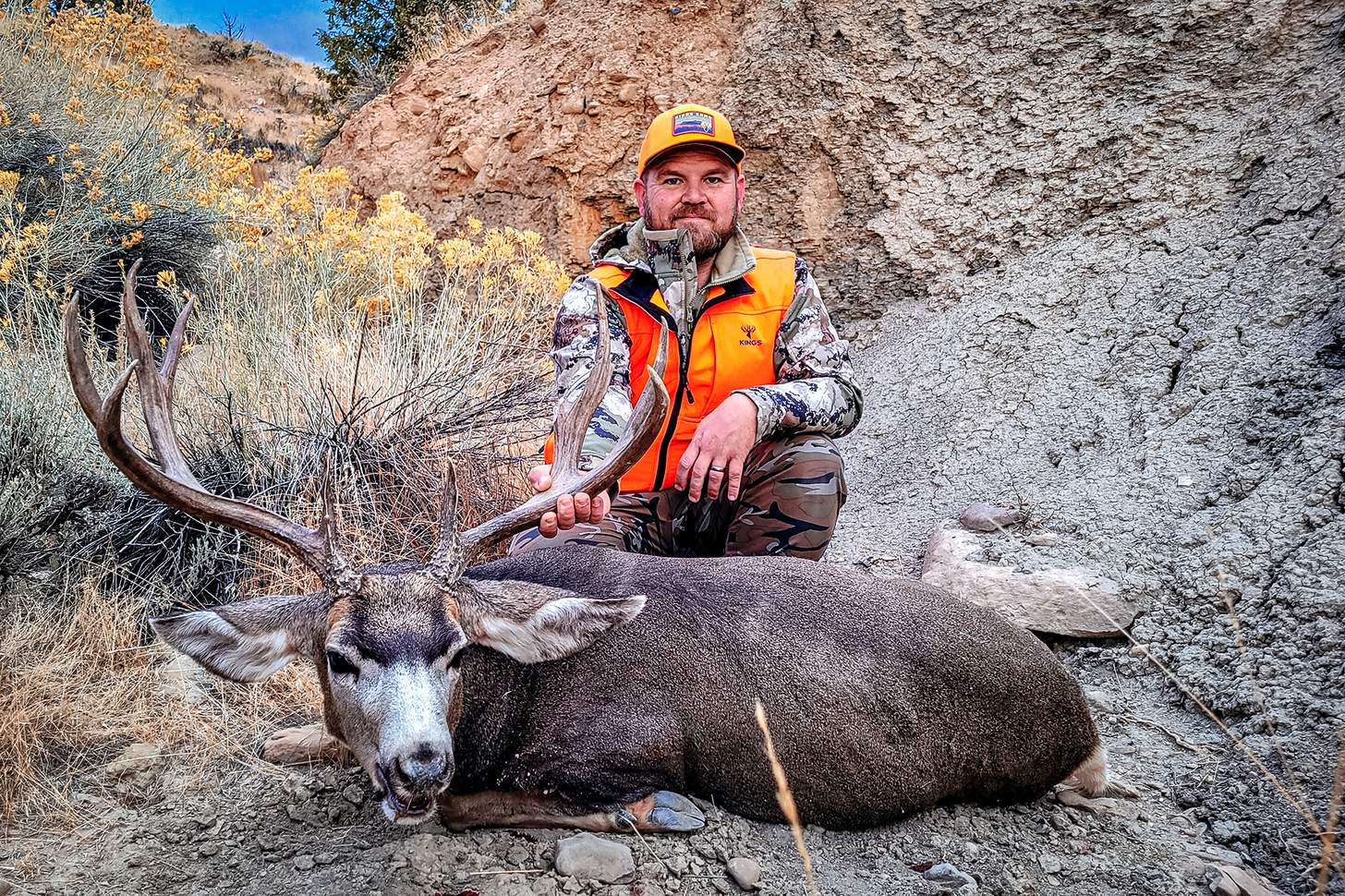Barnes Harvest hunting ammunition hunter with a nice muley buck
