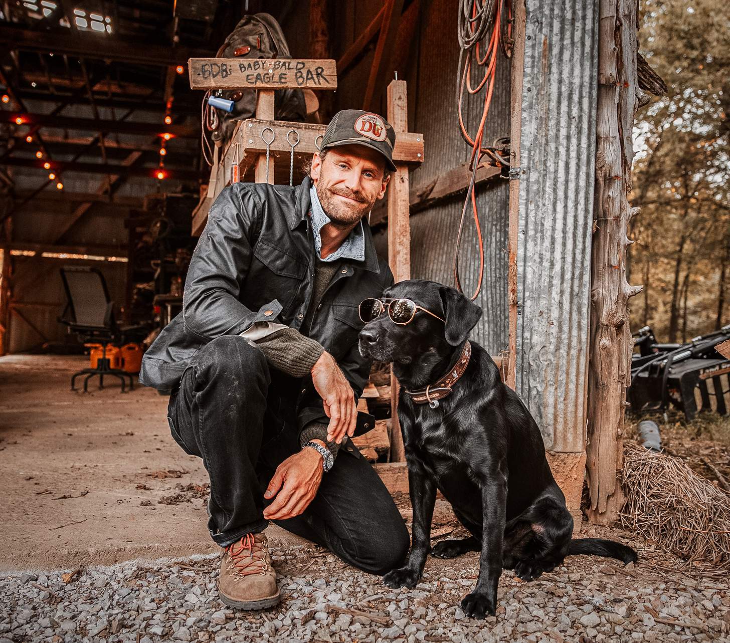 Chase Rice with his dog wearing sunglasses
