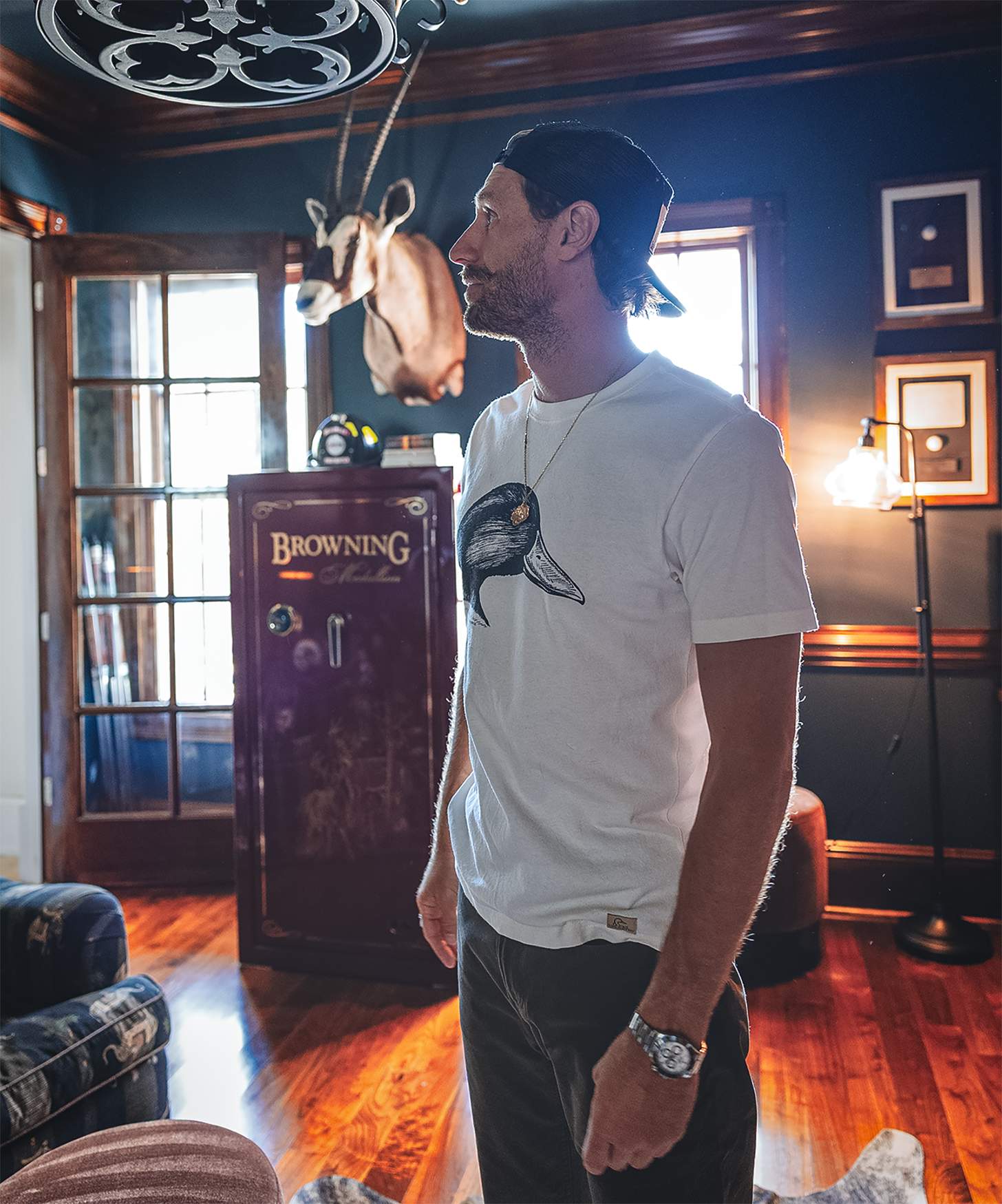 chase rice in front of a mount and a gun safe