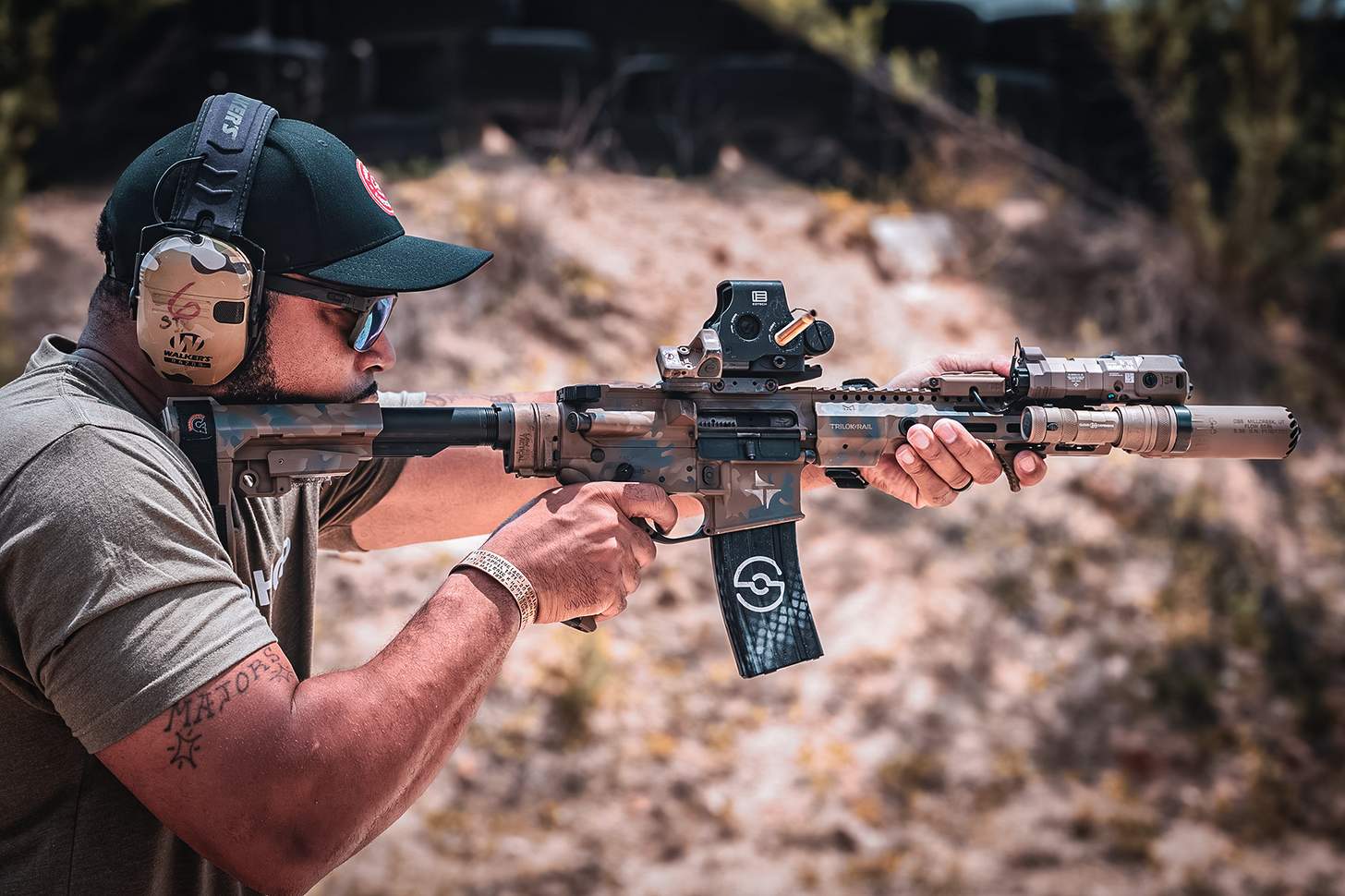 AR SBR with a suppressor and numerous attachments