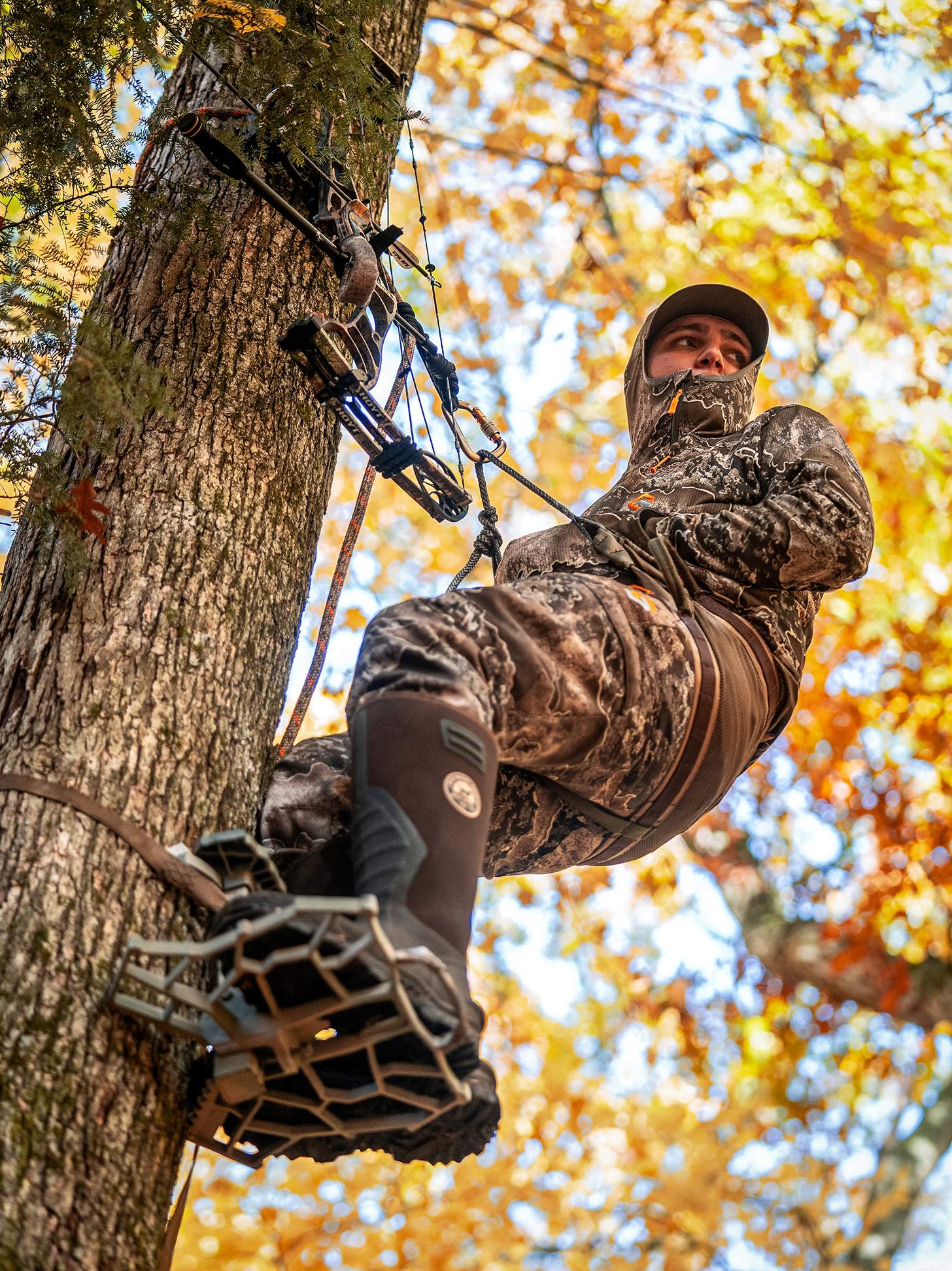 a young bowhunter in a hunting saddle