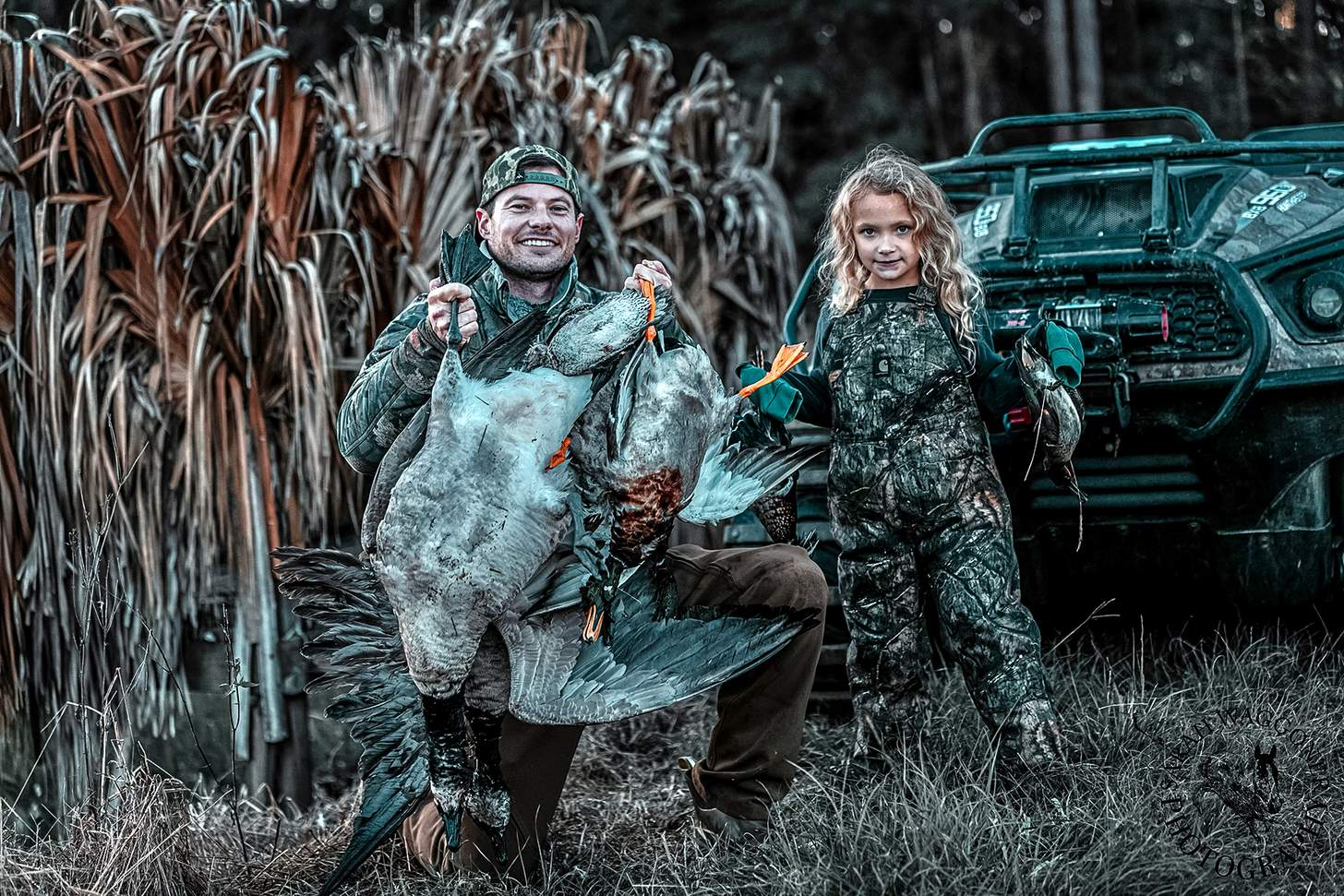Drew McIntosh of Migra Ammunition with his daughter and ducks