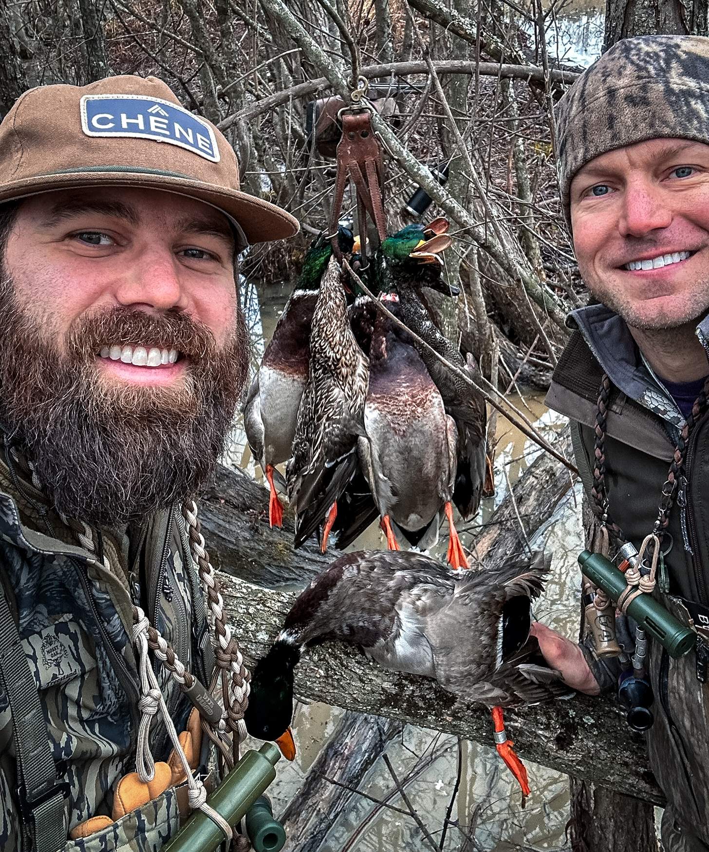 Jordan Davis and another hunter with several mallards