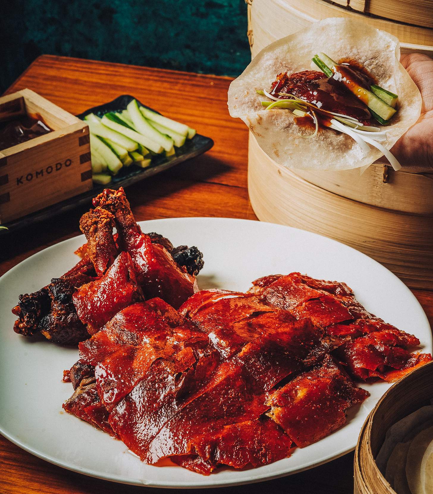 peking duck carved on a plate with wraps