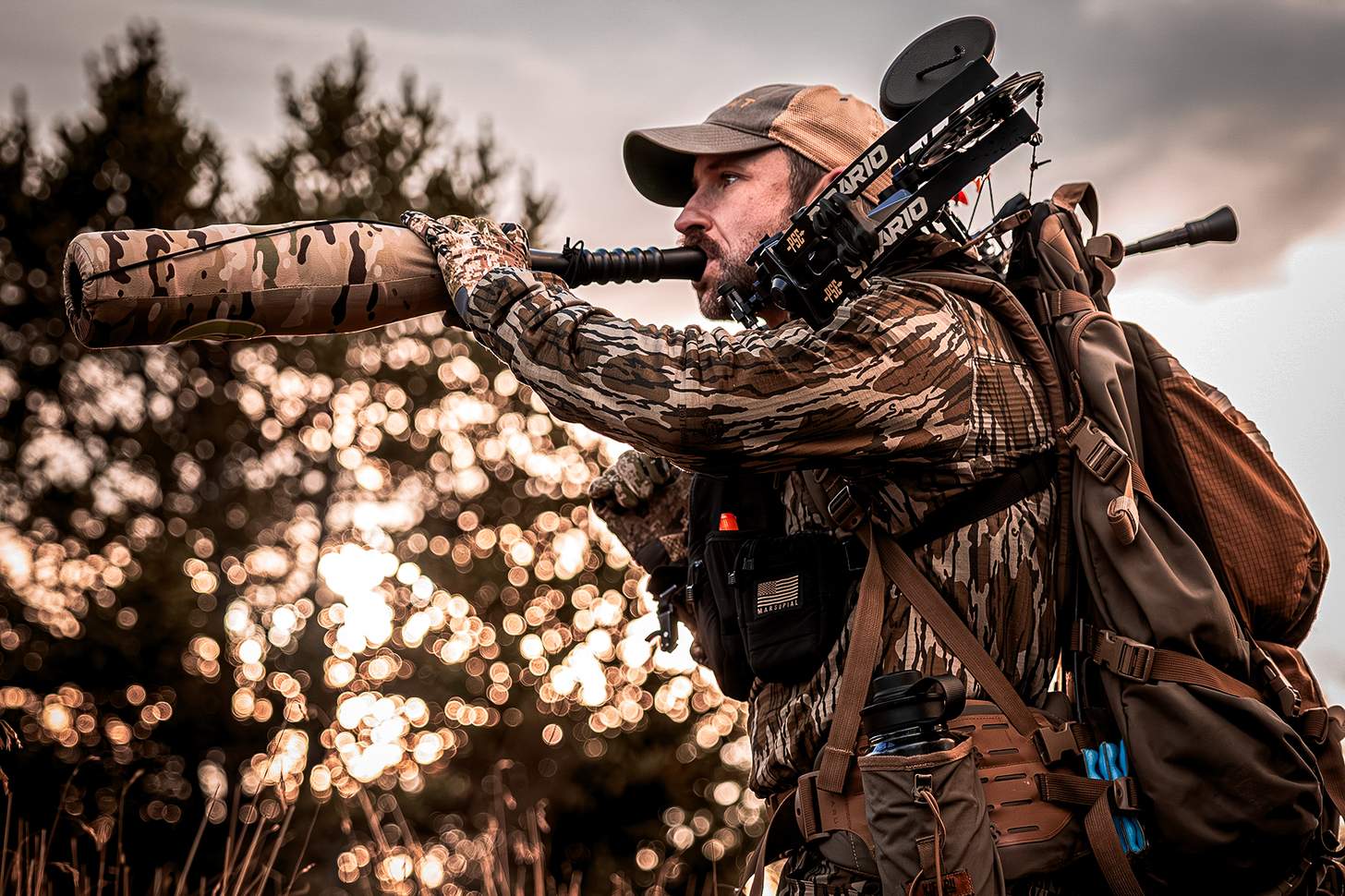 an elk hunter bugleing