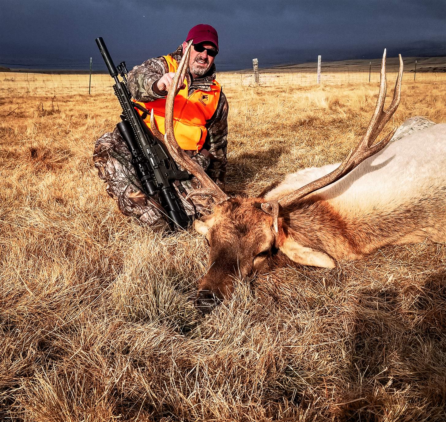 the author with a an elk hunted with a suppressor