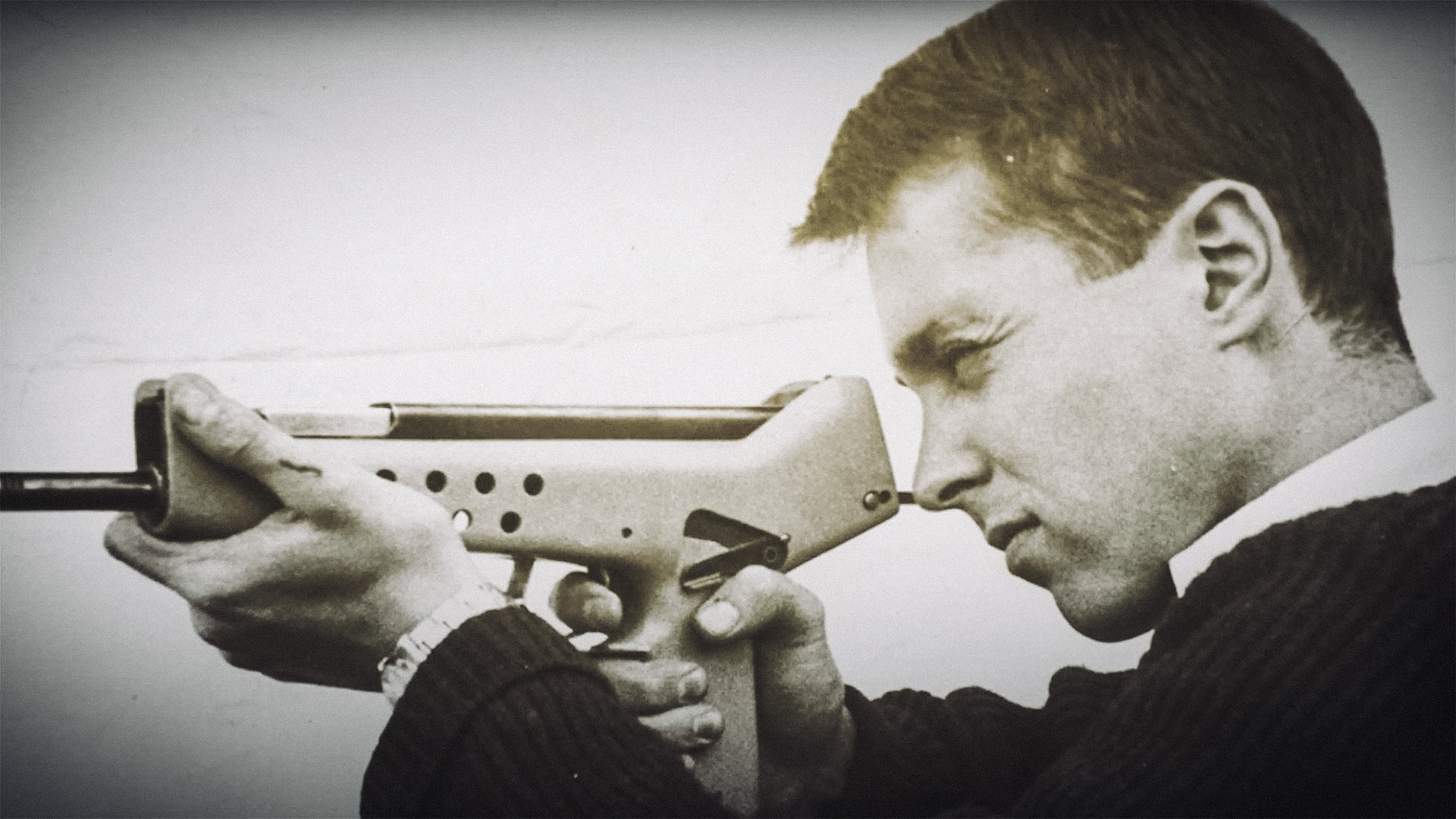 George Kellgren in younger years with a prototype firearm