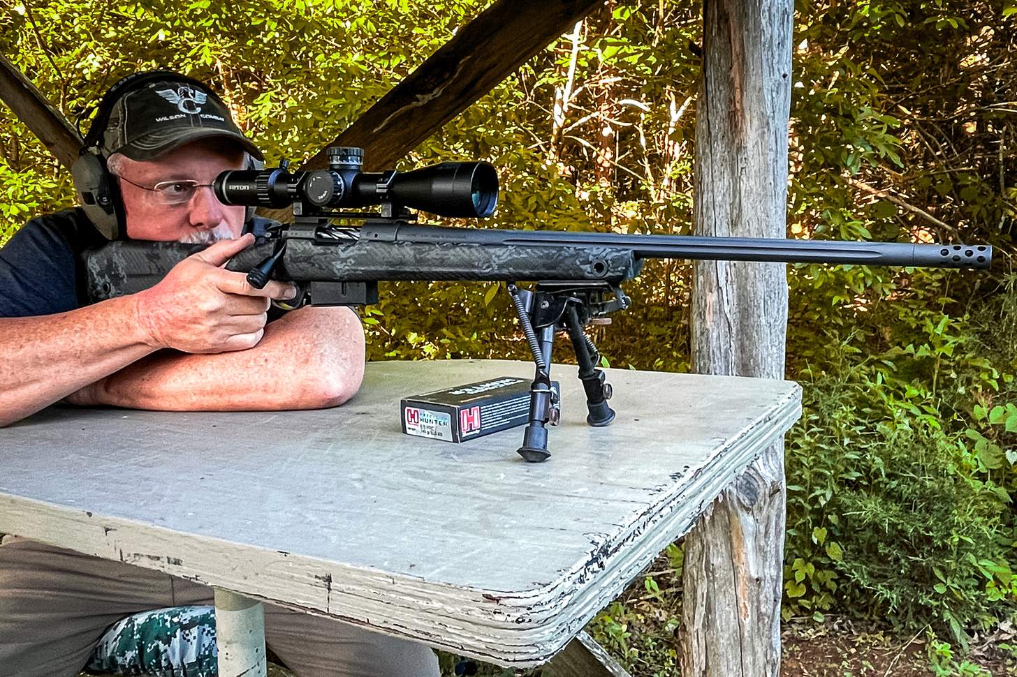 a man shooting a 6.5 PRC rifle