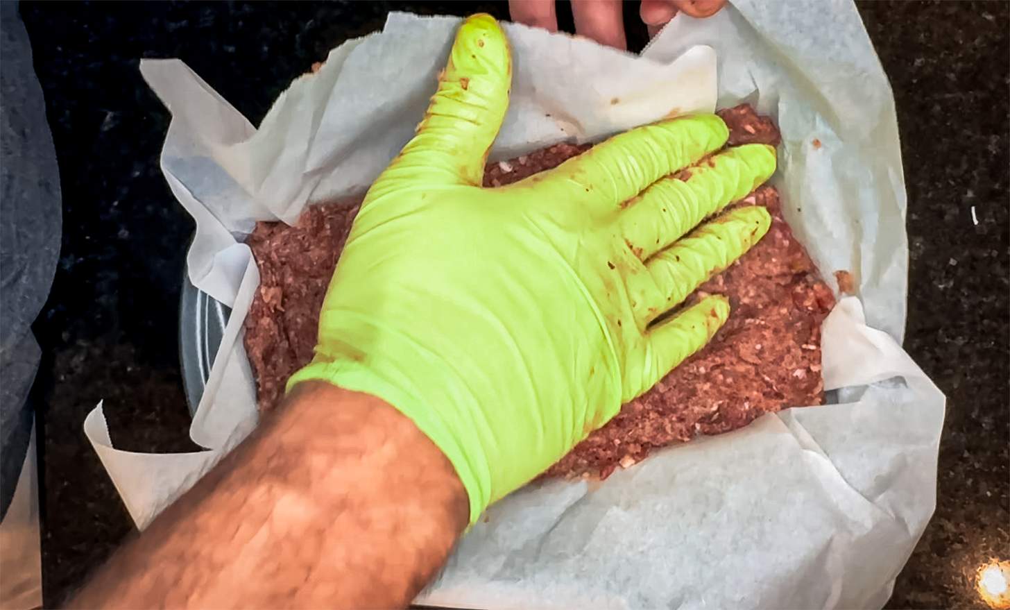 placing meat in loaf pan