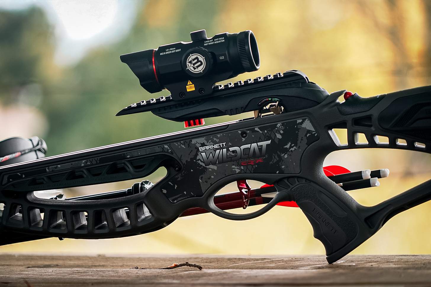 left side featuring the included red-dot precision optic