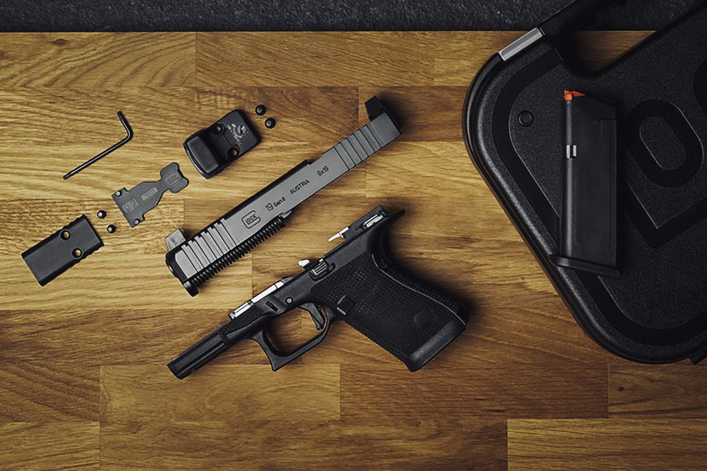 A GLOCK G19 Gen6 with the slide removed an optic assembly