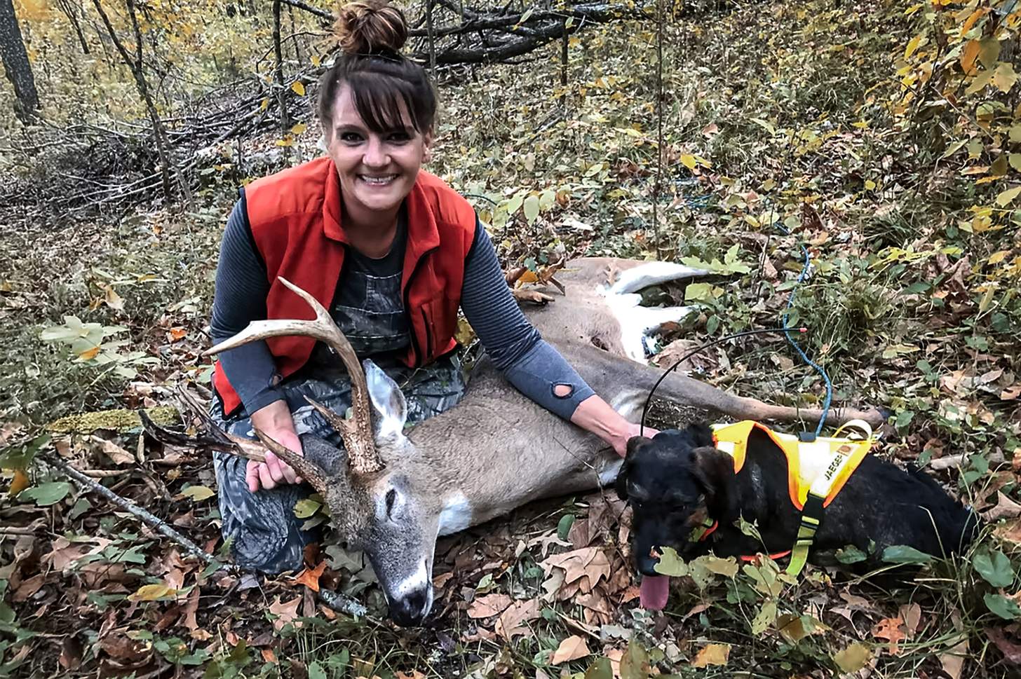 jaeger the deer tracking dog with a happy hunter and nice buck
