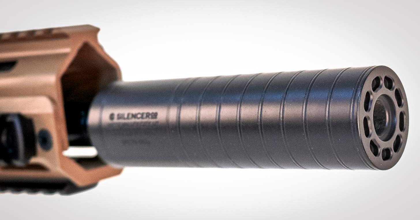 a SilencerCo Spectre 9 suppressor installed