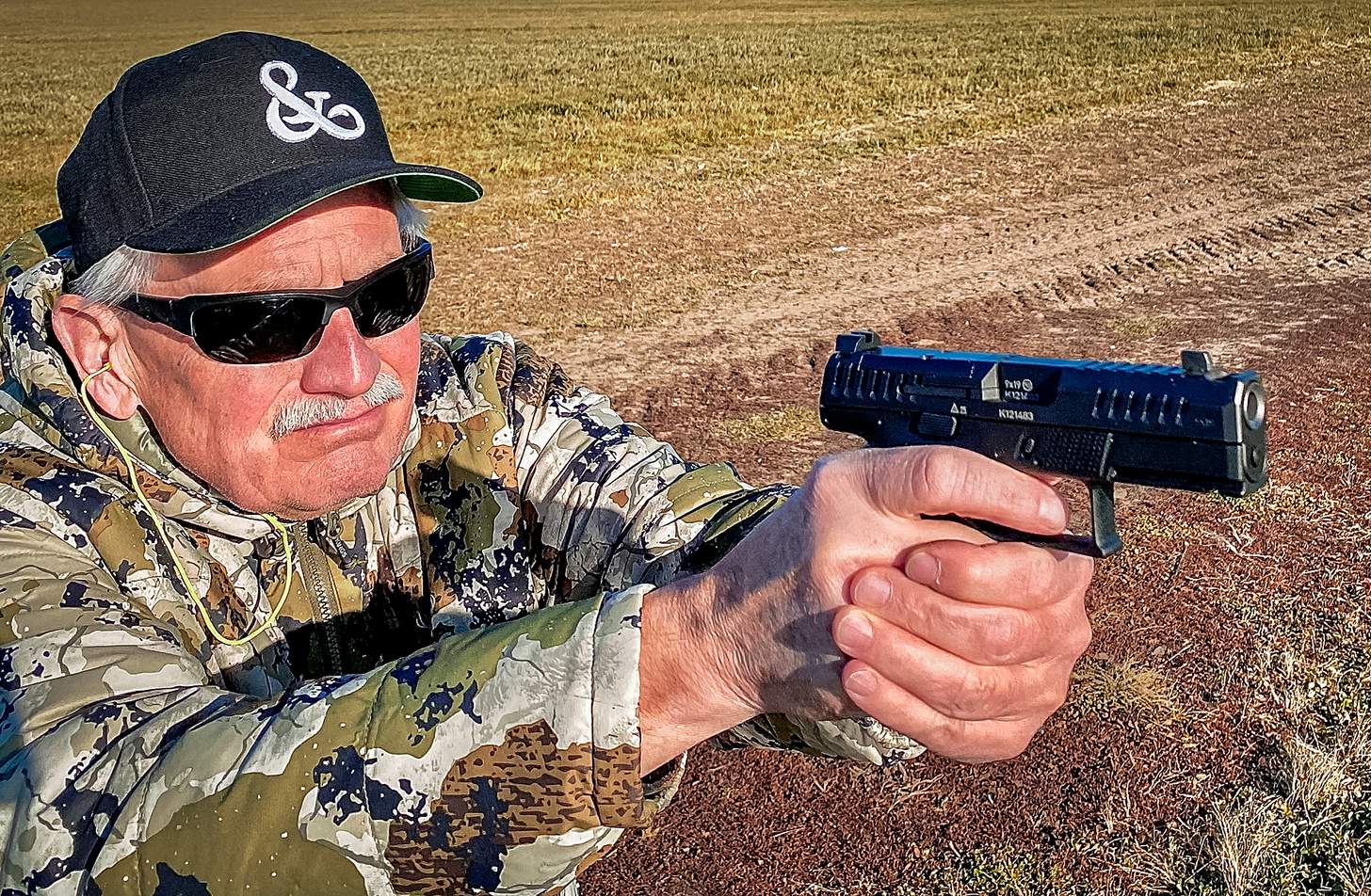 author firing the CZ-USA P-10 C Ported handgun