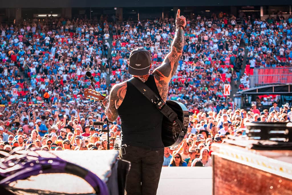 Zac Brown on stage giving a thumbs up to the crowd