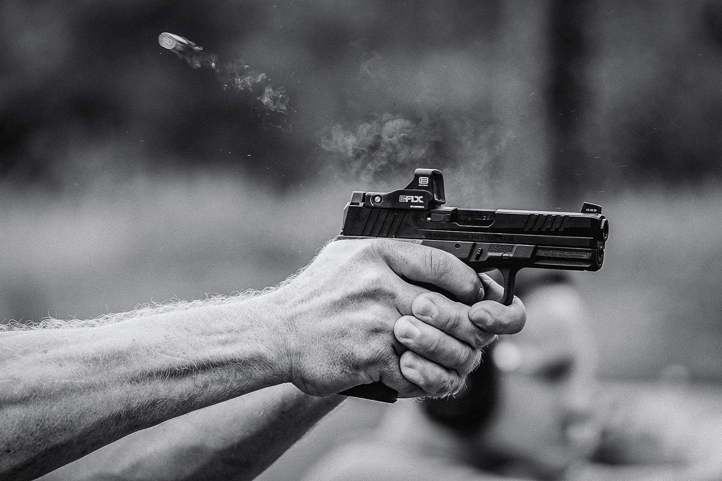 Ruger RXM handgun firing with red dot