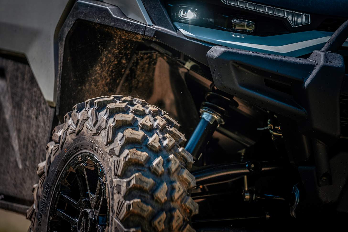 close-up of front tire and suspension of Can-Am Defender