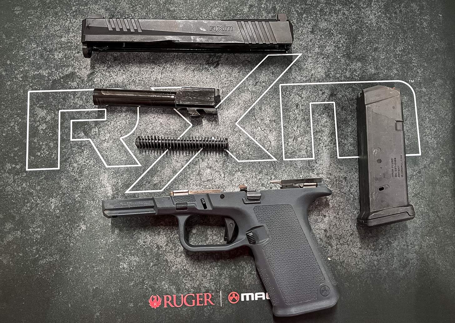 Ruger RXM handgun disassembled