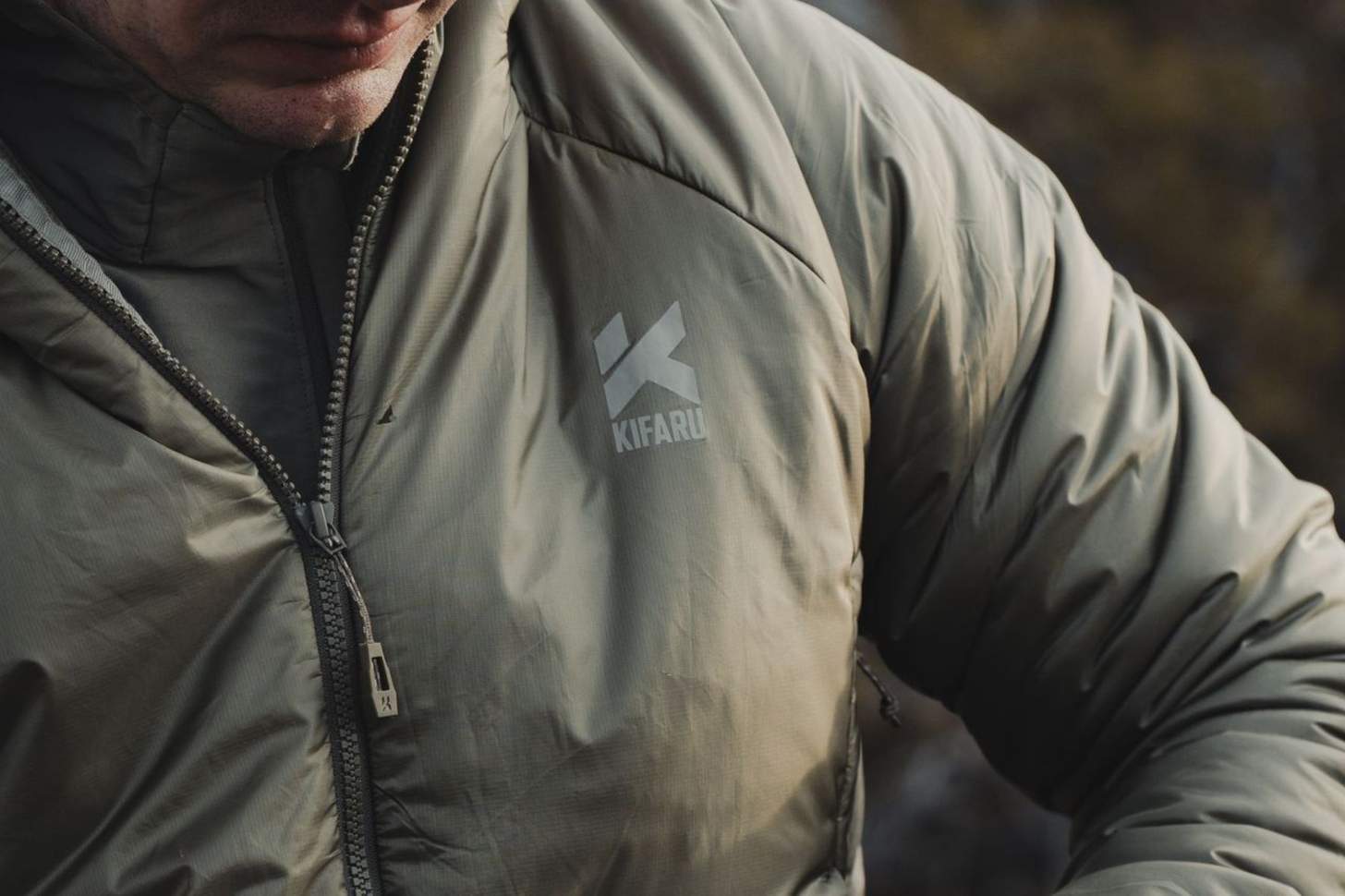 A closeup of the Kifaru logo on a puffy jacket.