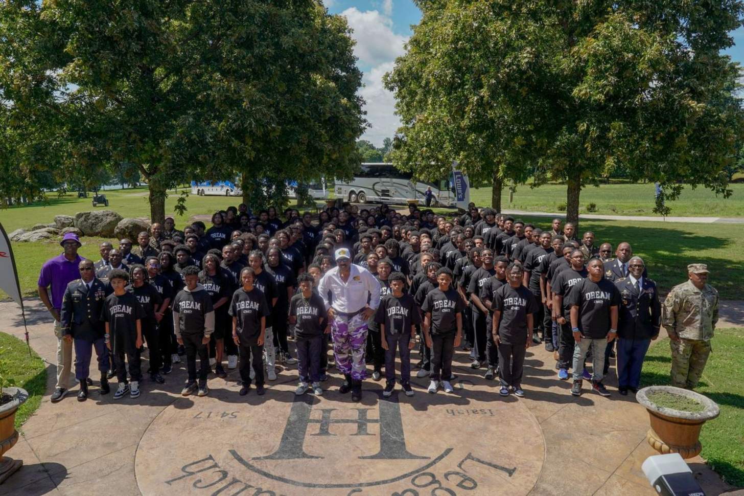Steve Harvey stands proudly alongside his mentees from the Steve Harvey Mentoring Program, celebrating growth, leadership and the power of mentorship.